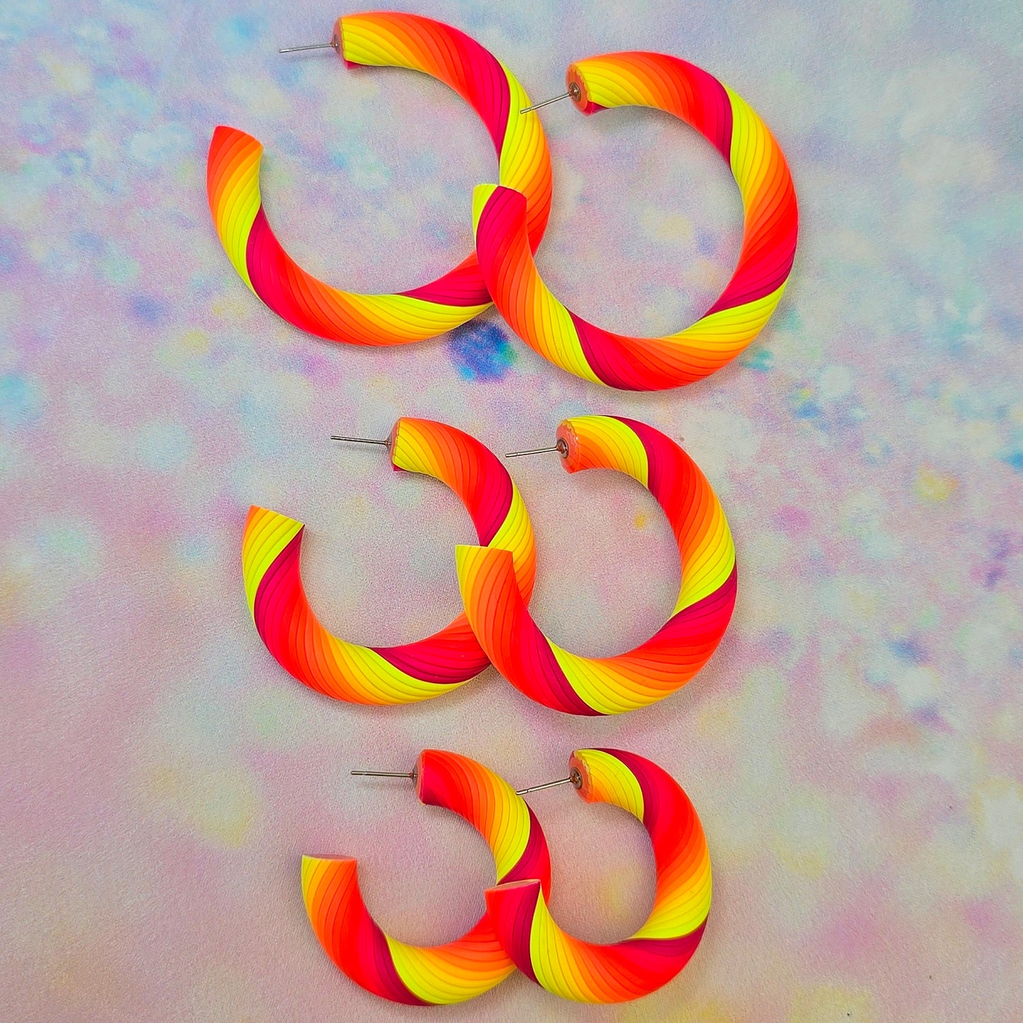 Malibu Glow Twisted Hoops